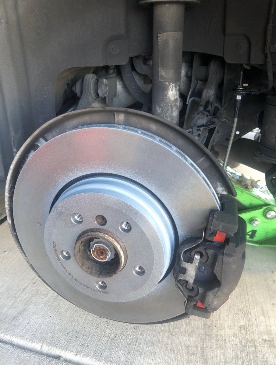 New rotor and caliper fitted during an Atlanta brake repair